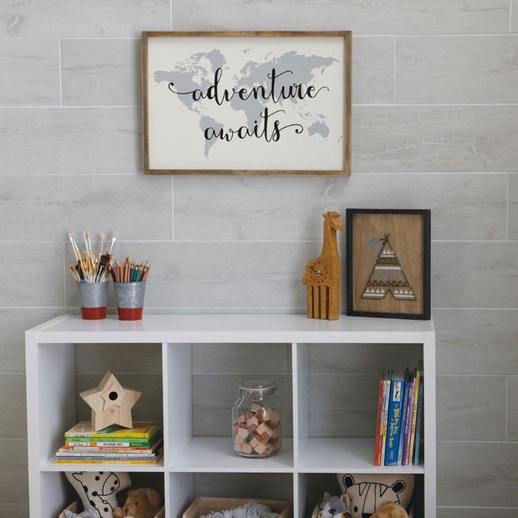 wood look porcelain installed on the wall behind shelves with adventure sign