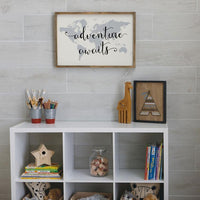 wood look porcelain installed on the wall behind shelves with adventure sign