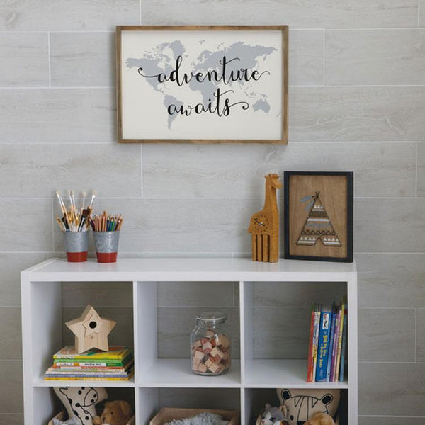 wood look porcelain installed on the wall behind shelves with adventure sign