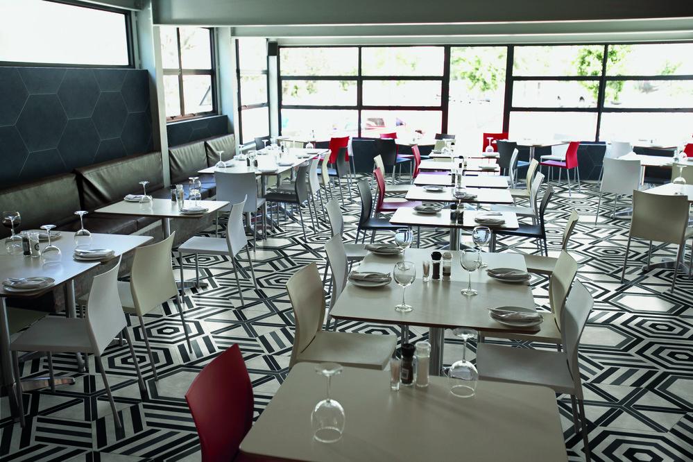 hexagon tile in a blend of cool patterns on a restaurant floor. 