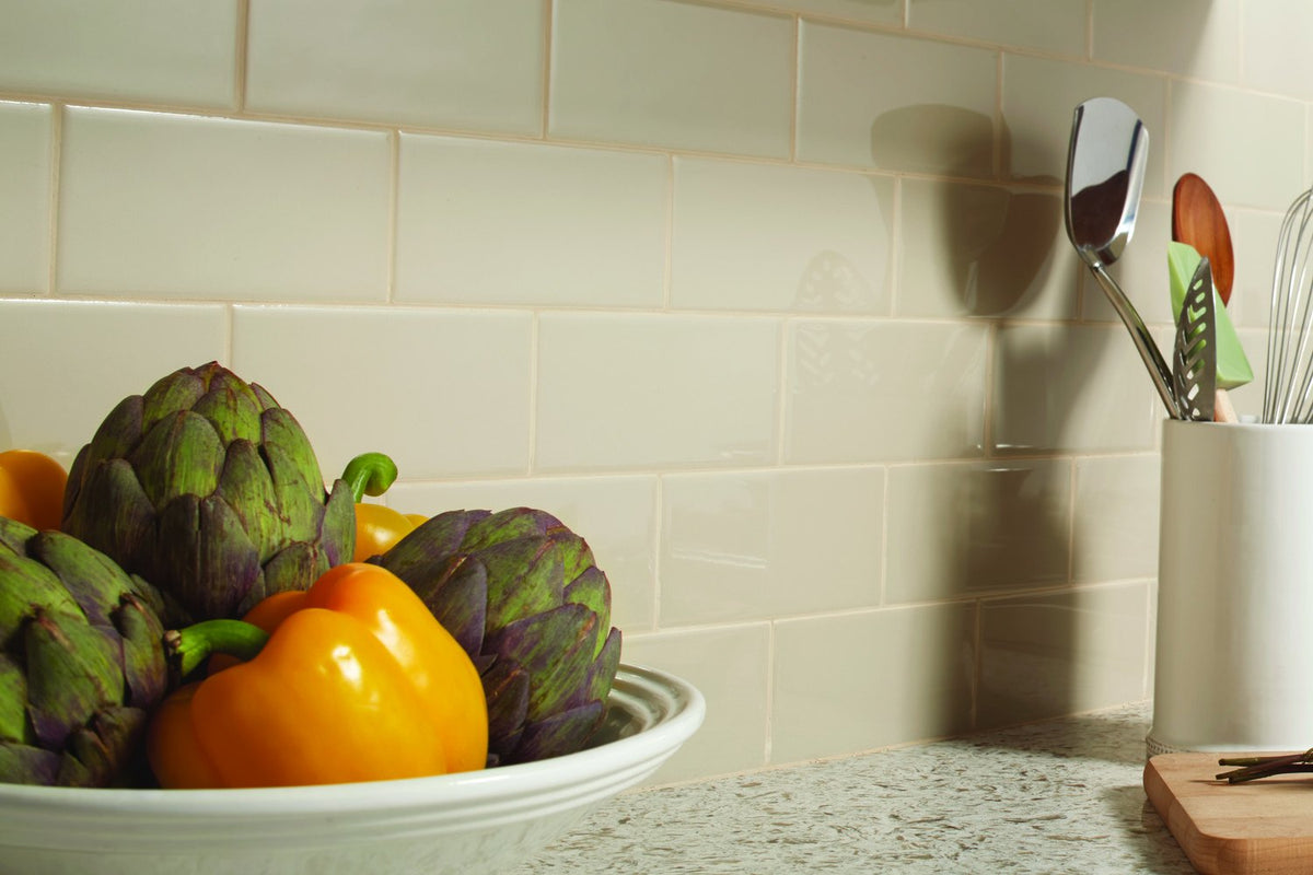 almond gloss ceramic tile on kitchen backsplash wall subway tile