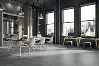 simply grey tiles in large open concept office with large city windows