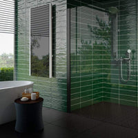 4x16 Gioia Avocado color tile on the wall of a modern bathroom.