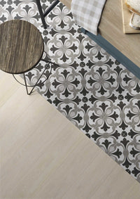 Gray rug porcelain pattern tile on the floor with wood in view.