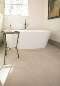 nobility white porcelain tile on floor of light, modern bathroom