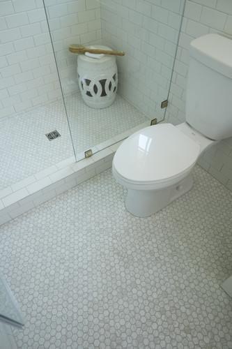carrara hexagon tiles shown on bathroom floor